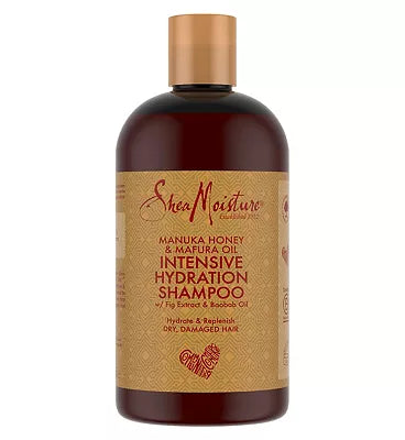 Shea Moisture shampoo bottle with gold cap on a white background