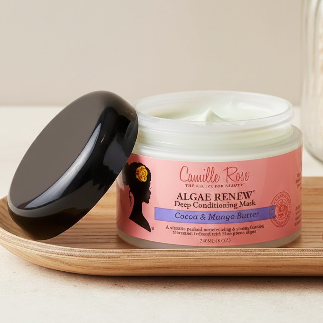 Camille Rose Algae Renew Deep Conditioning Mask jar on a wooden tray
